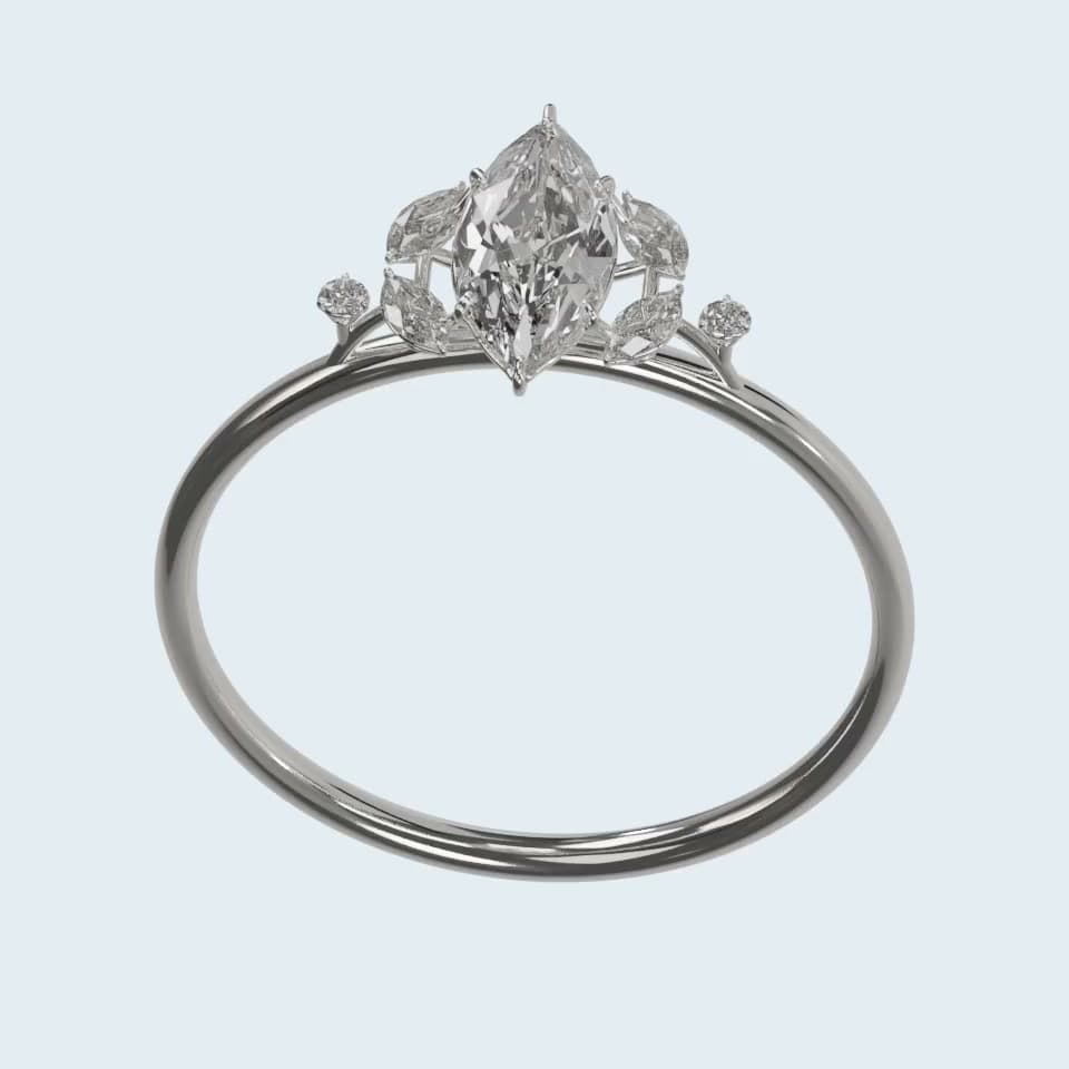 The finished marquise diamond ring with its center stone secured in the setting